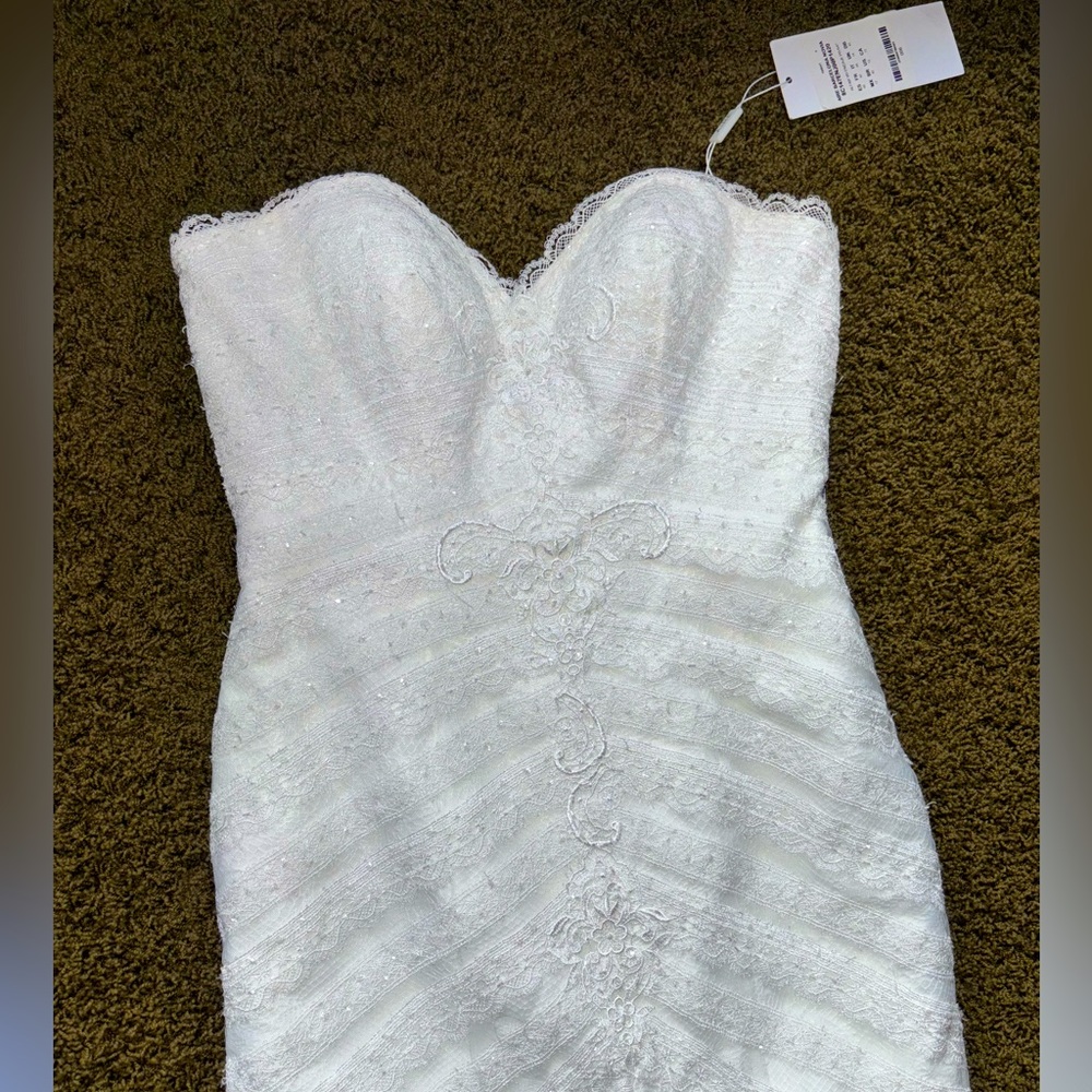 NWT designer wedding dress. Bought from “The White Dress” size 10 never altered - Picture 8 of 16